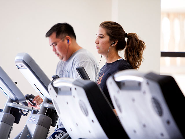 Students exercise in one of the on-campus facilities