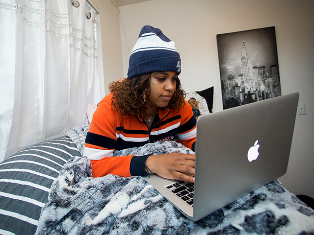 A USD student studies in the residence halls