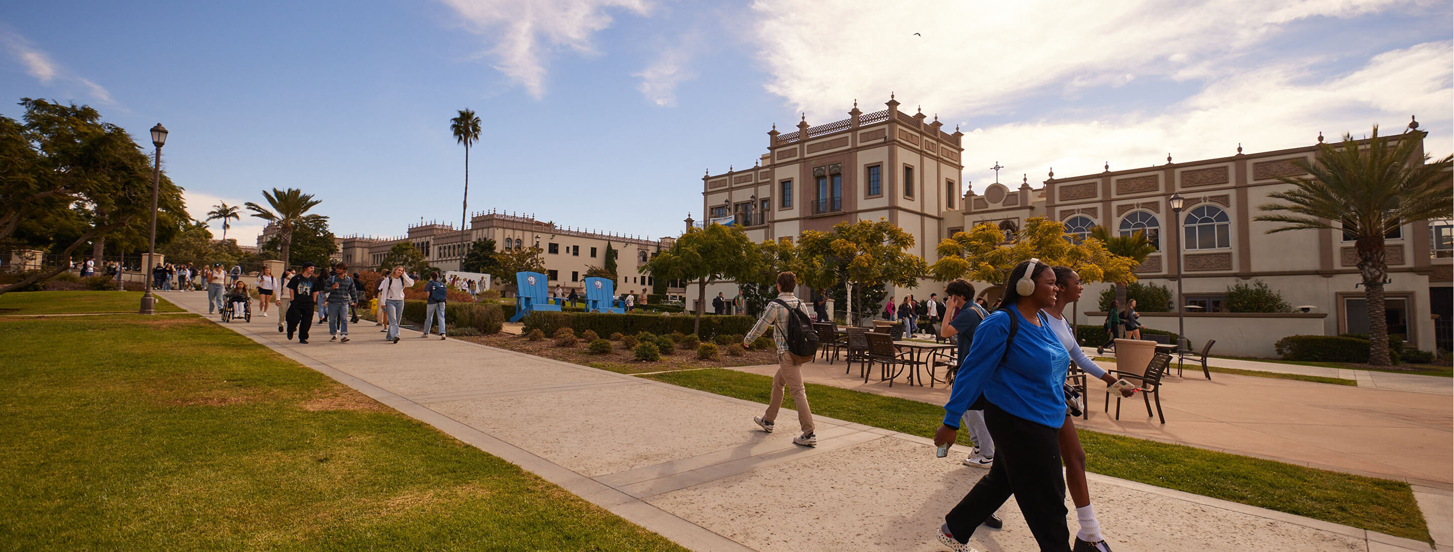 students walking through campus in the late afternoon