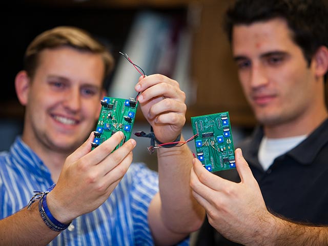 Someone holding a technical device