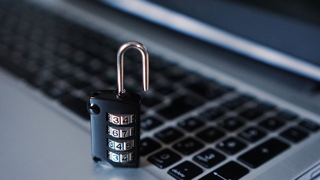 An open padlock setting on a computer keyboard