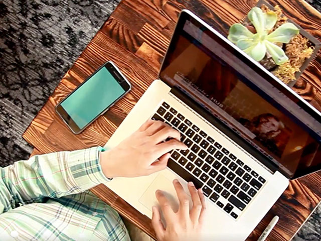 Someone typing on a laptop keyboard