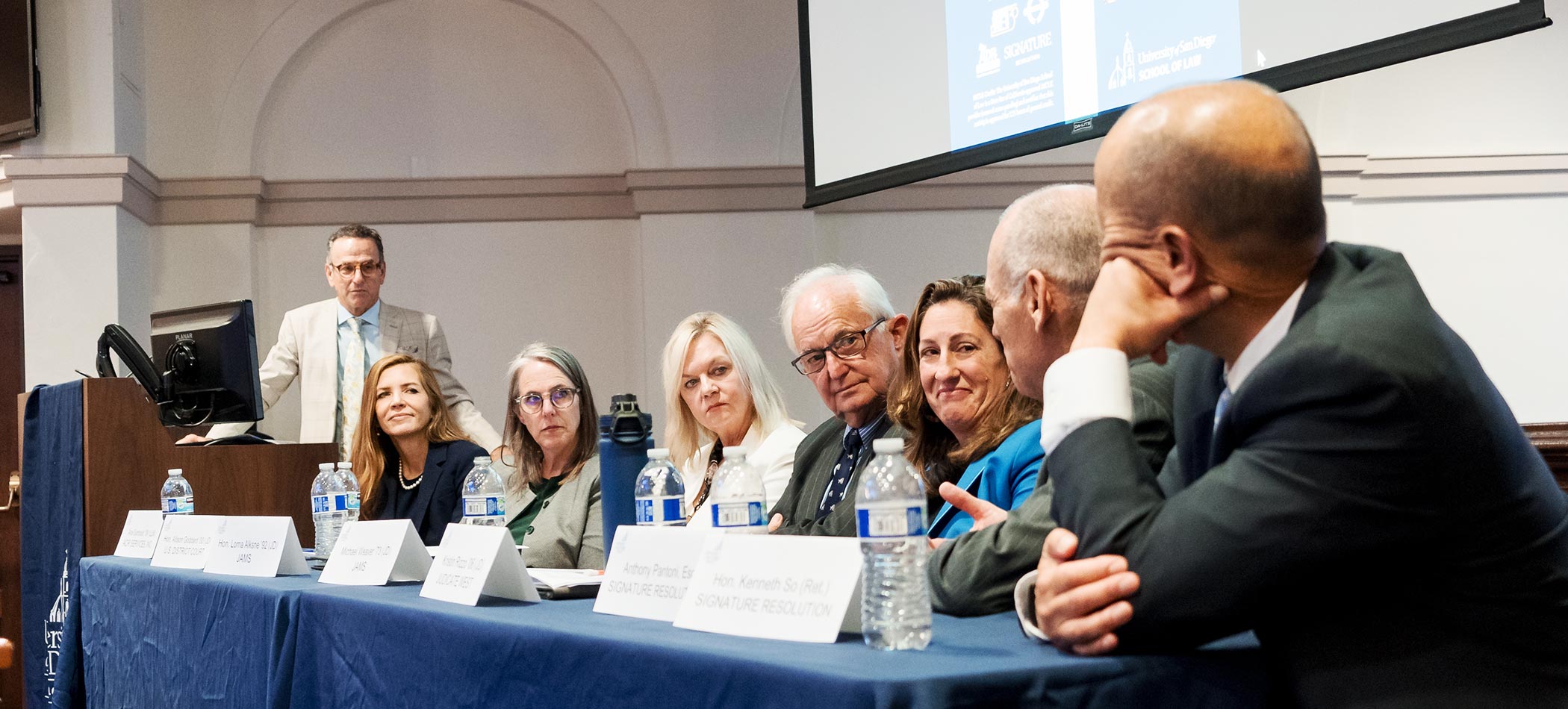 A panel of faculty speaking