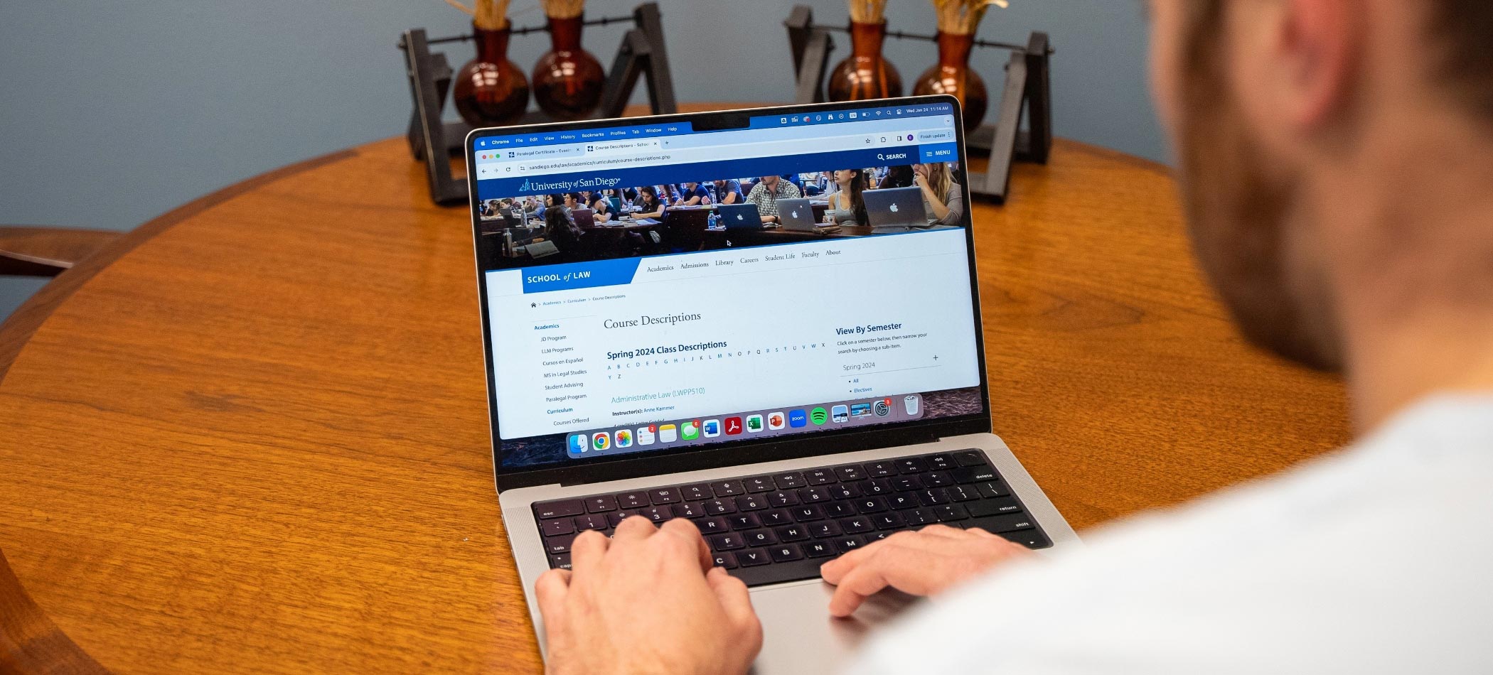 someone typing on a laptop