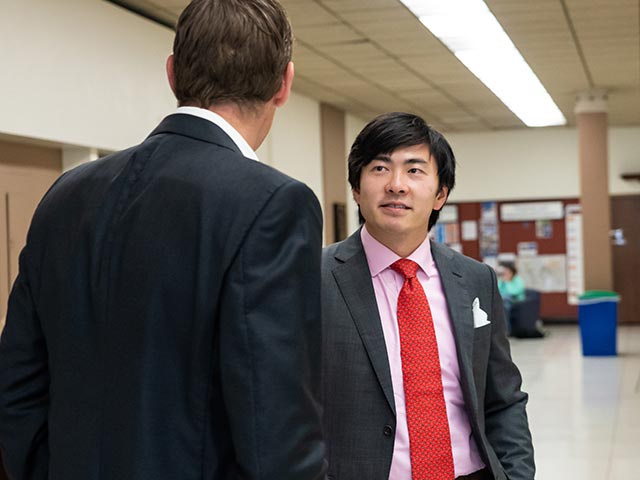 students talking in the hallway