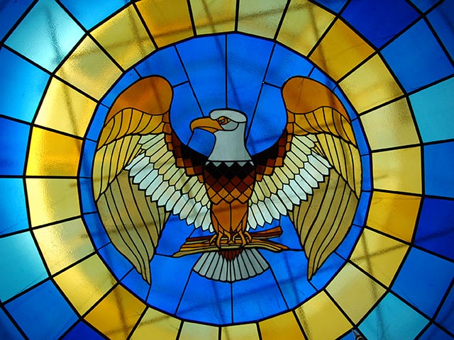 The glass stained ceiling of the courtroom on campus