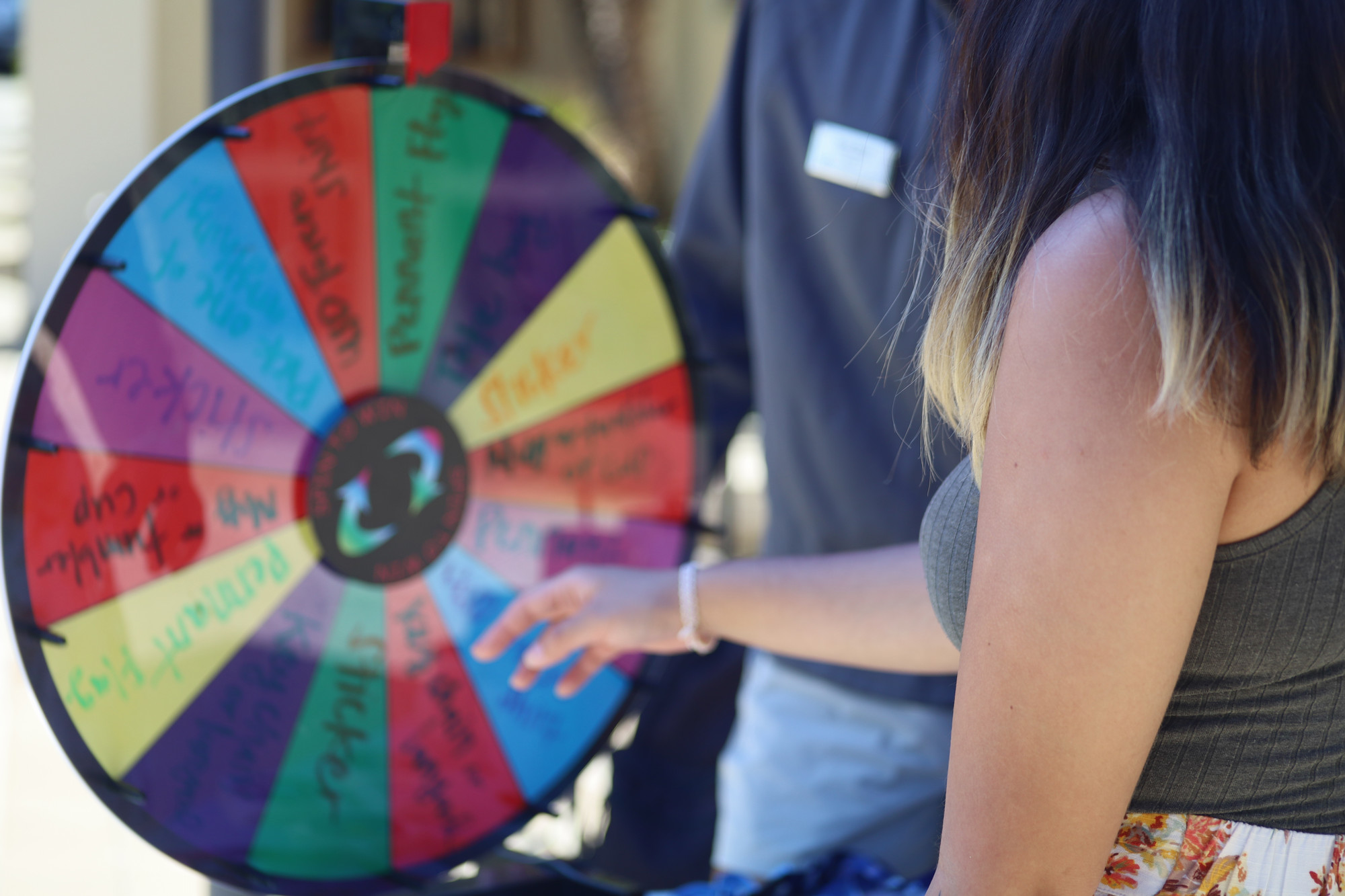 Picture of someone spinning the Transfer Wheel of Prizes