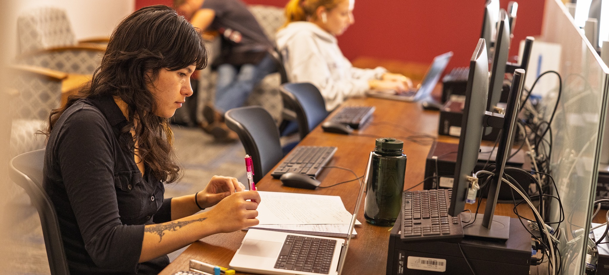 A student using a computer at the library