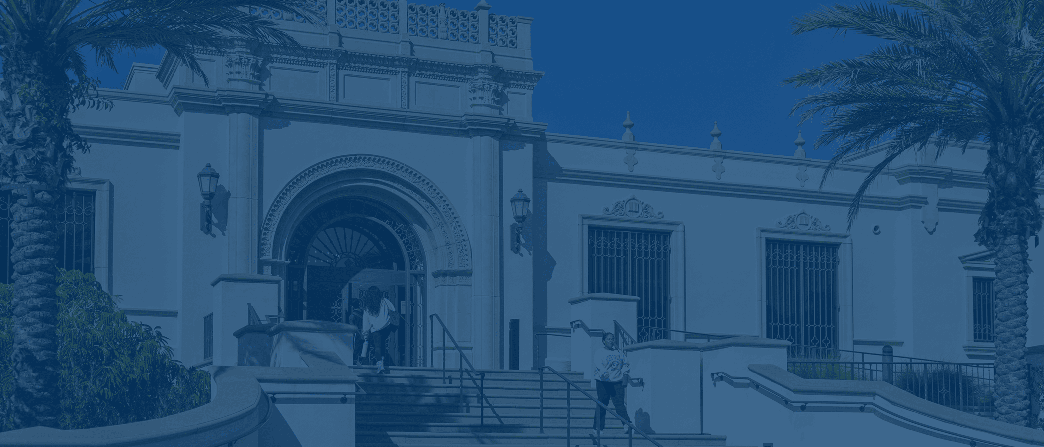 Photo of the exterior of Copley Library building, including front doorway and stairs