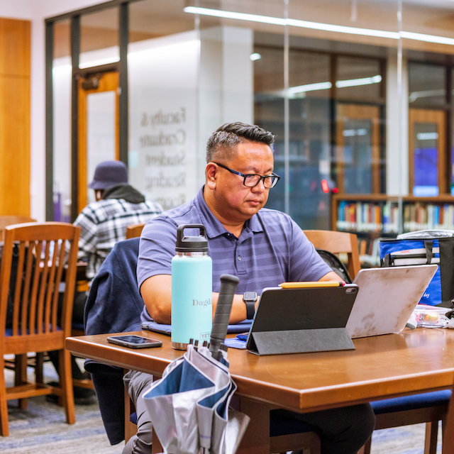 Student Studying at Table