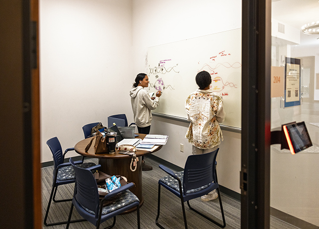 Students working in one of the copley library rooms