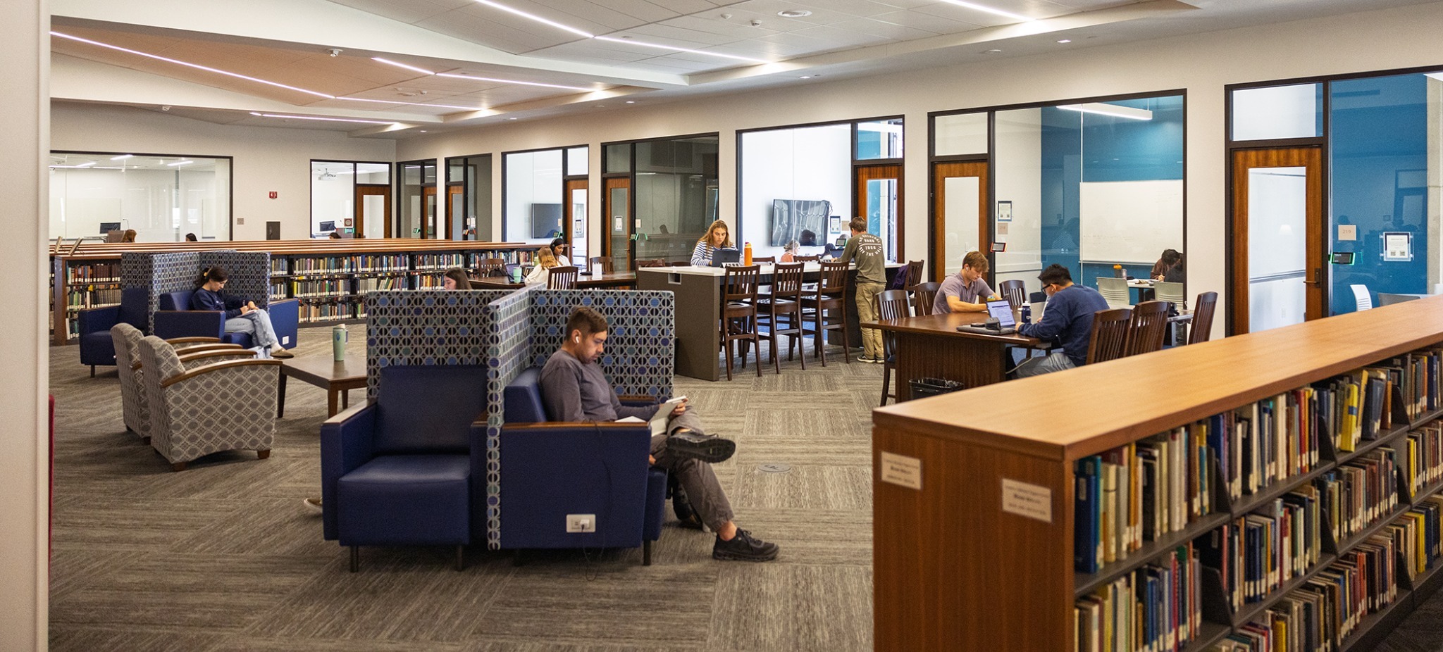 image of library sitting area, with people reading