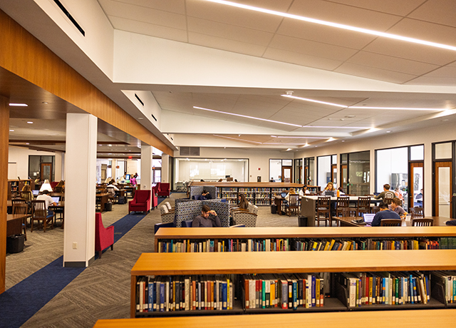 A student walking in the library