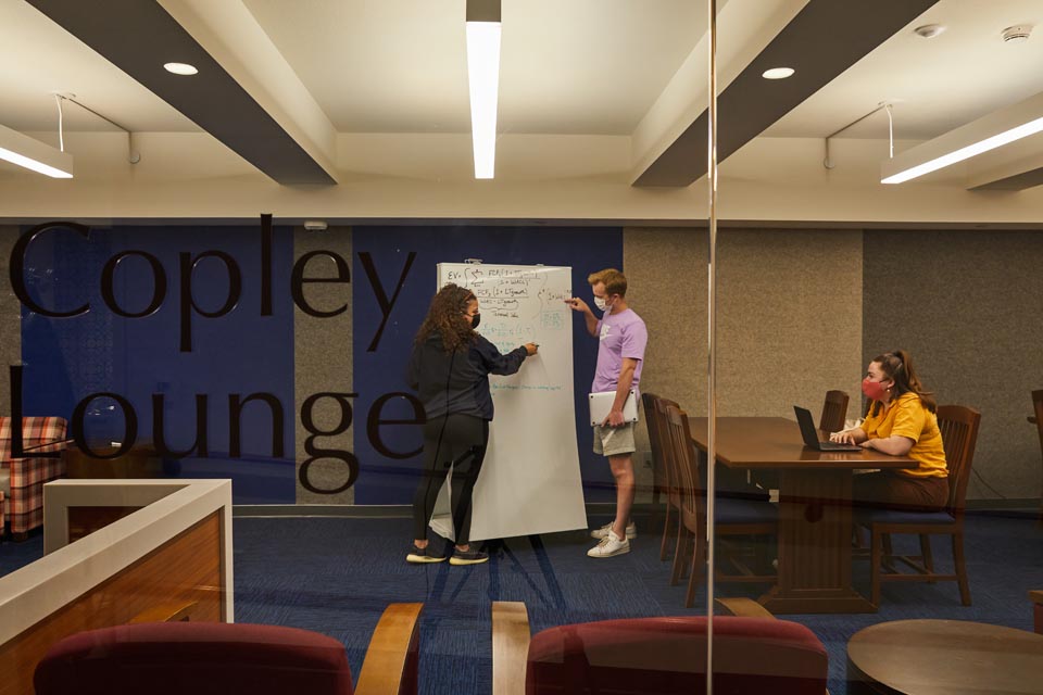 Students working in one of the copley library rooms