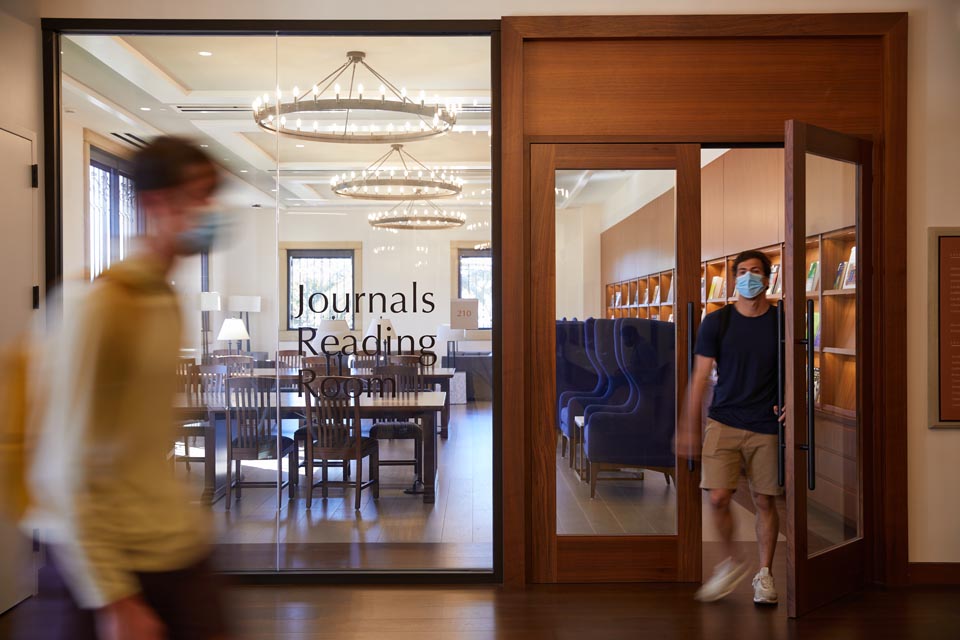 A student walking in the library