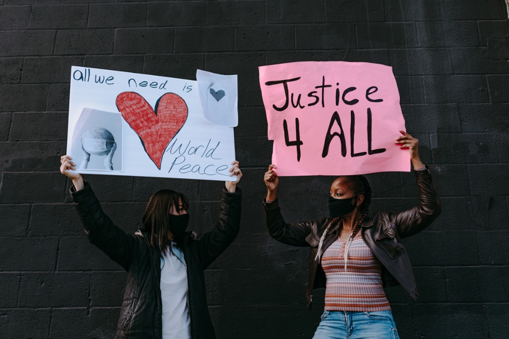 people holding up signs