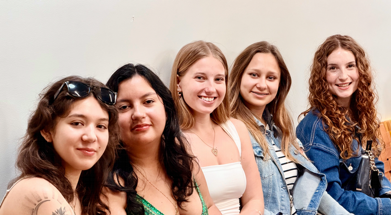 students smiling at the camera