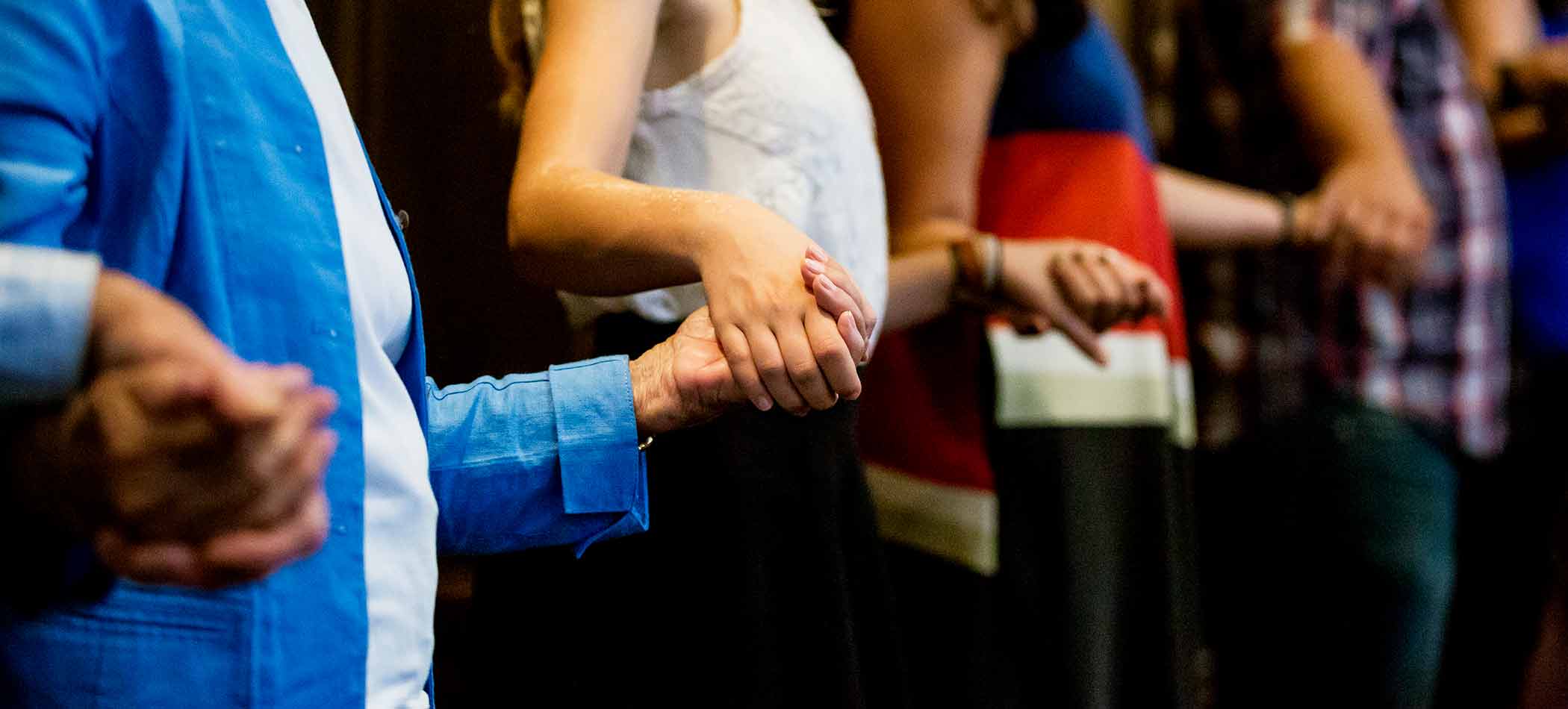 People holding hands during a church service