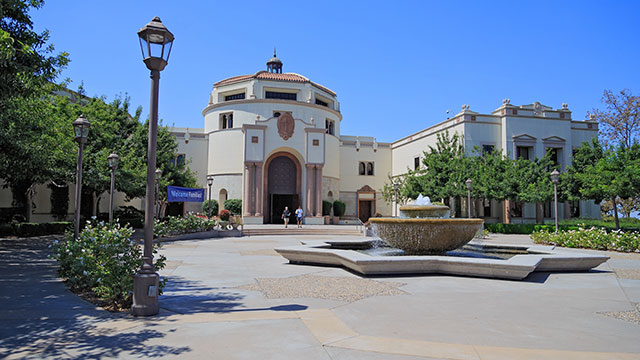 Outside of large building with courtyard out front