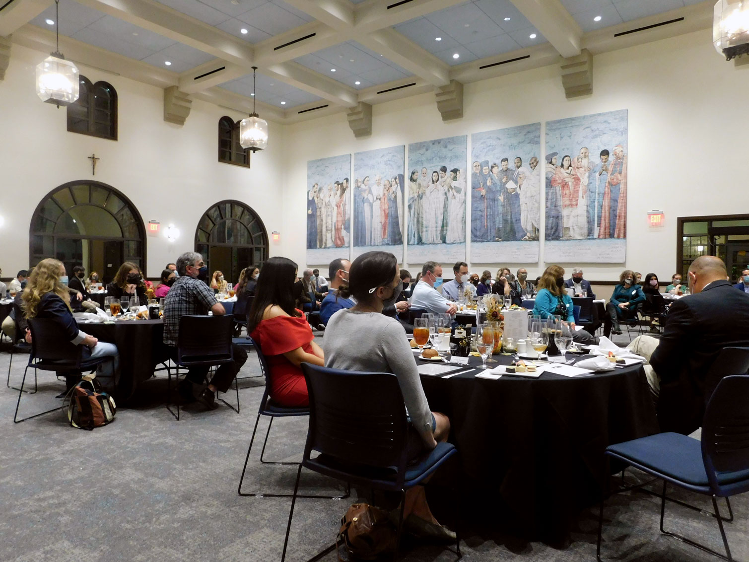 Tables set with guests in USD Ministry building