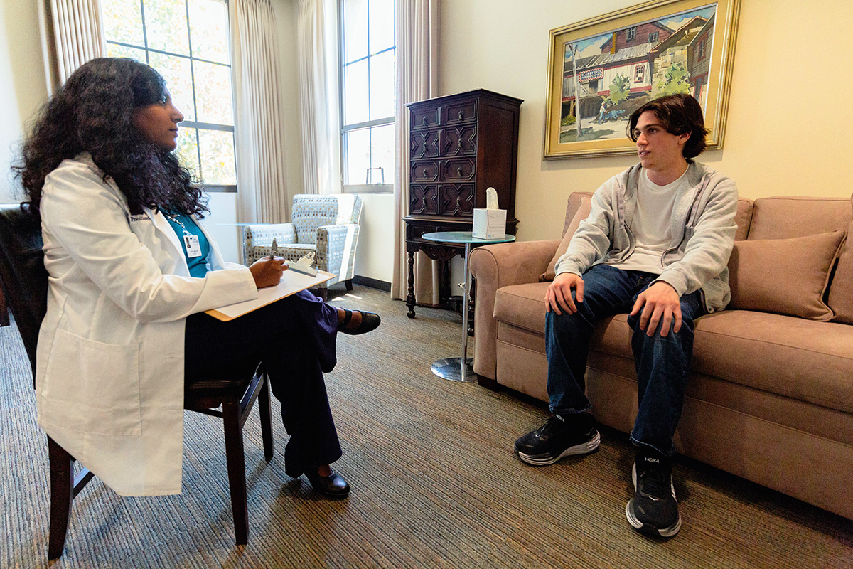 Psychiatric Nurse Practitioner student with a teen patient discussing mental health