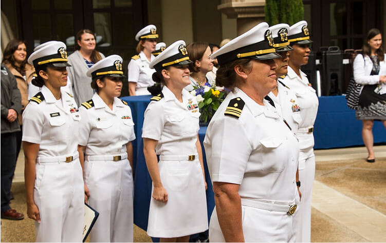 Navy nurses in uniform at pinning ceremony