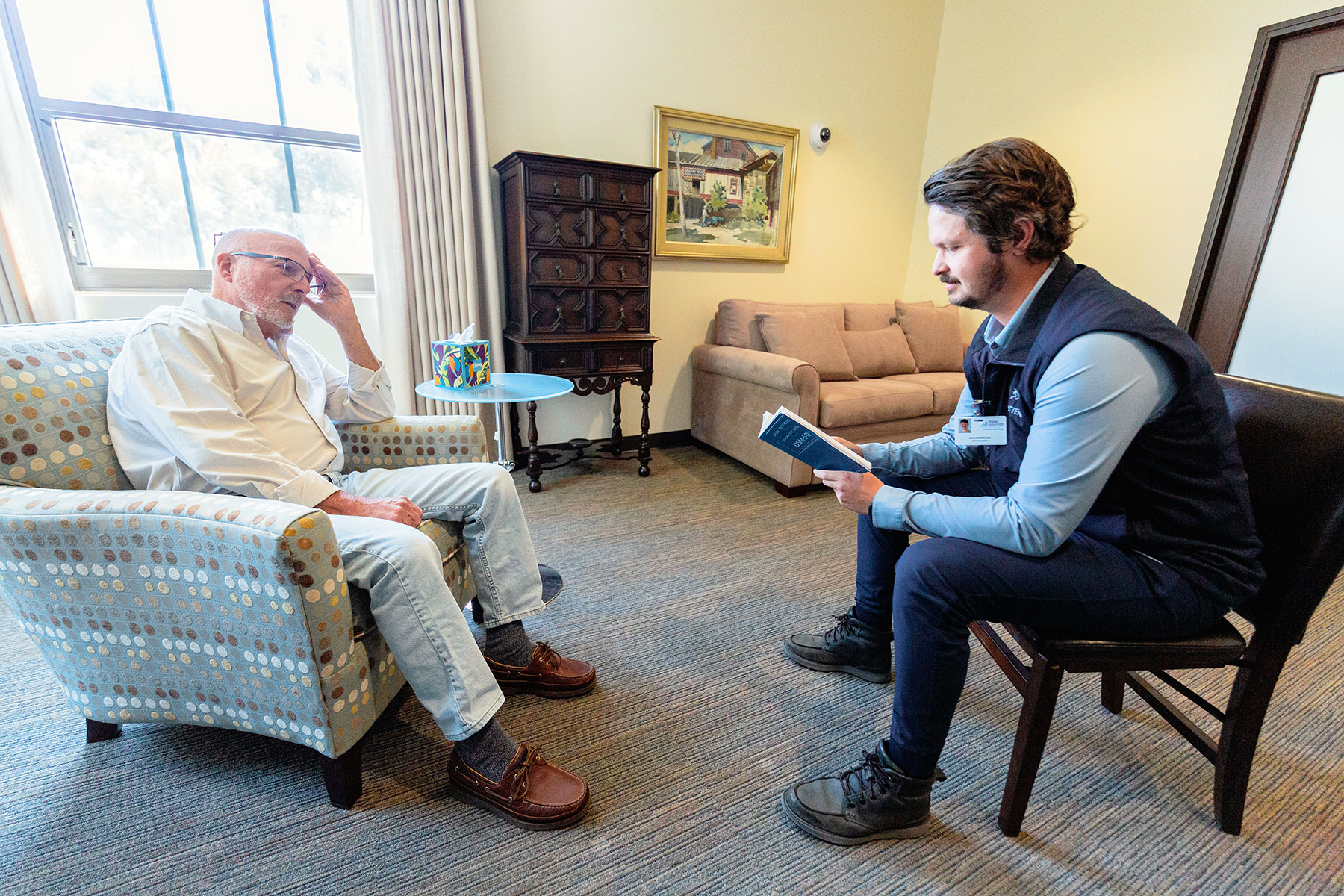 Psychiatric nurse practitioner meets with a patient during a mental health consultation.