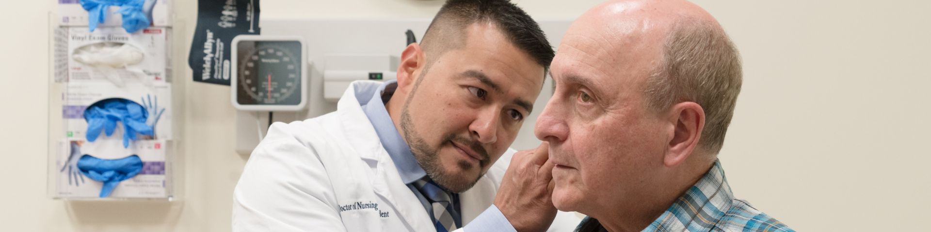 image of doctor working with patient