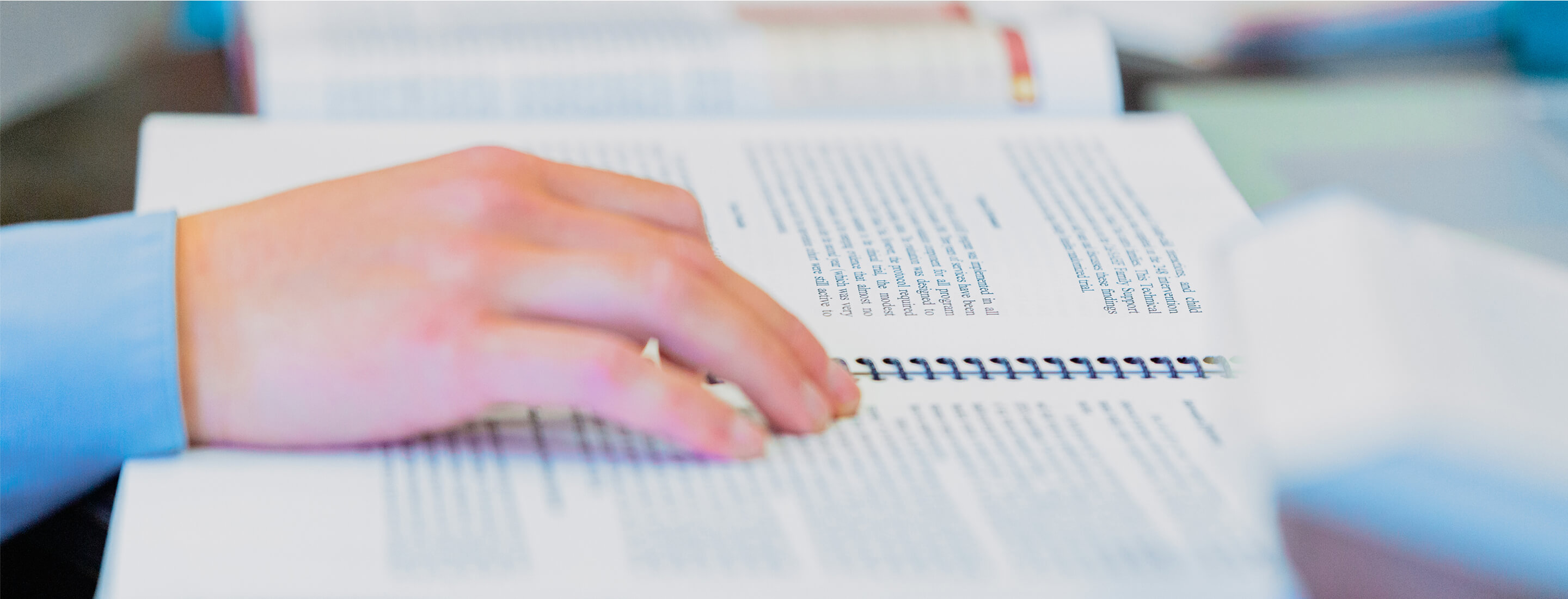 hand on open text book