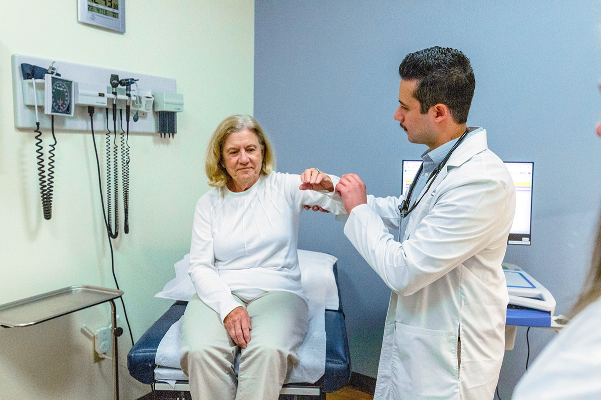 NP student examining patient