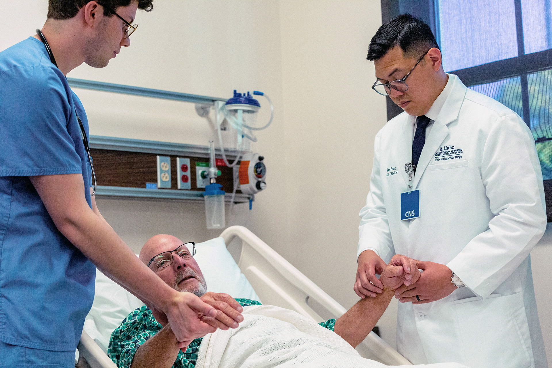 cns student during stroke code with mepn student assisting in sim lab