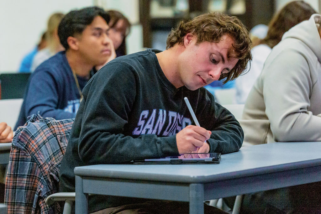 a student writing in class