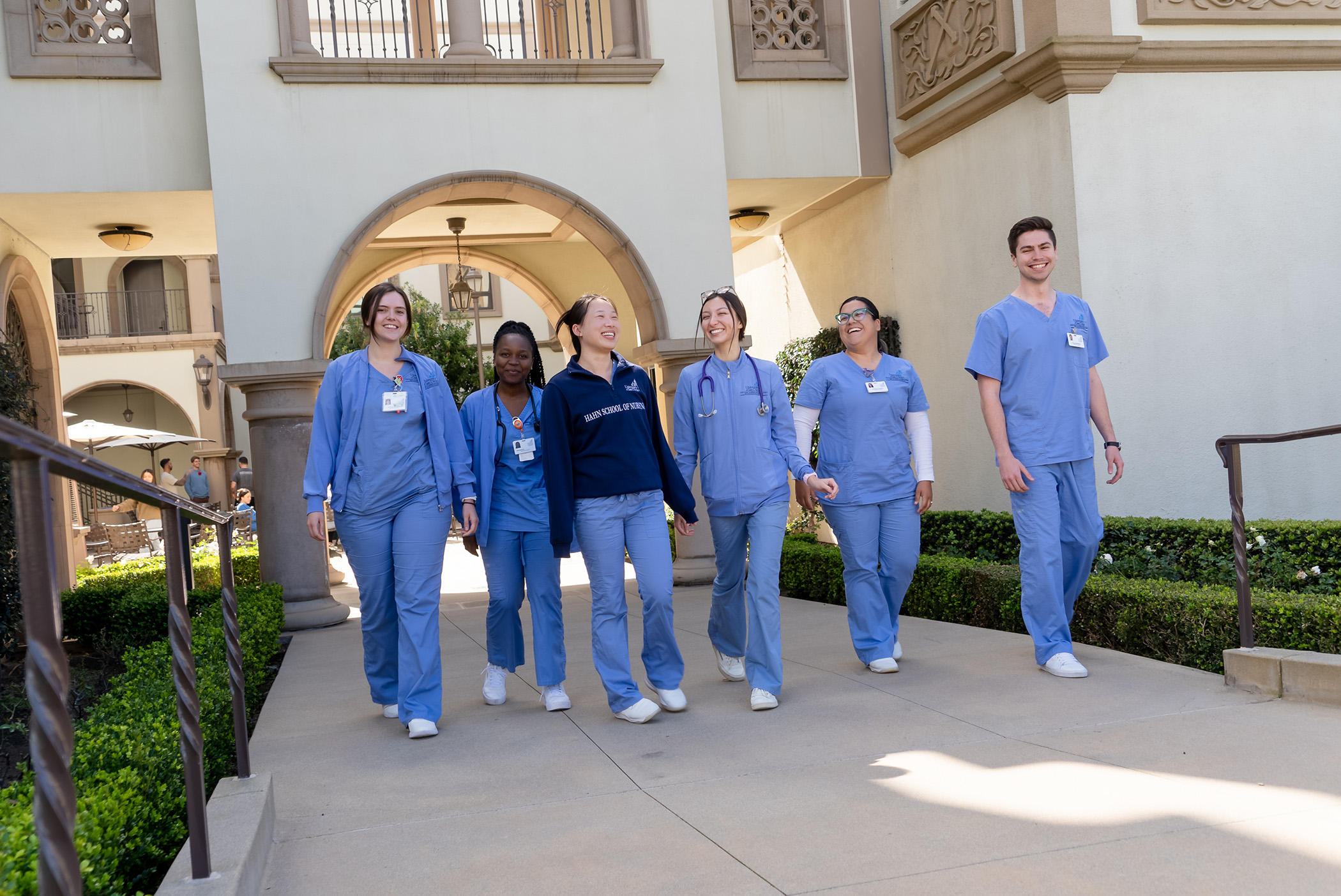 MEPN students in scrubs walking together