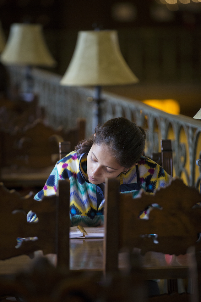 student in library