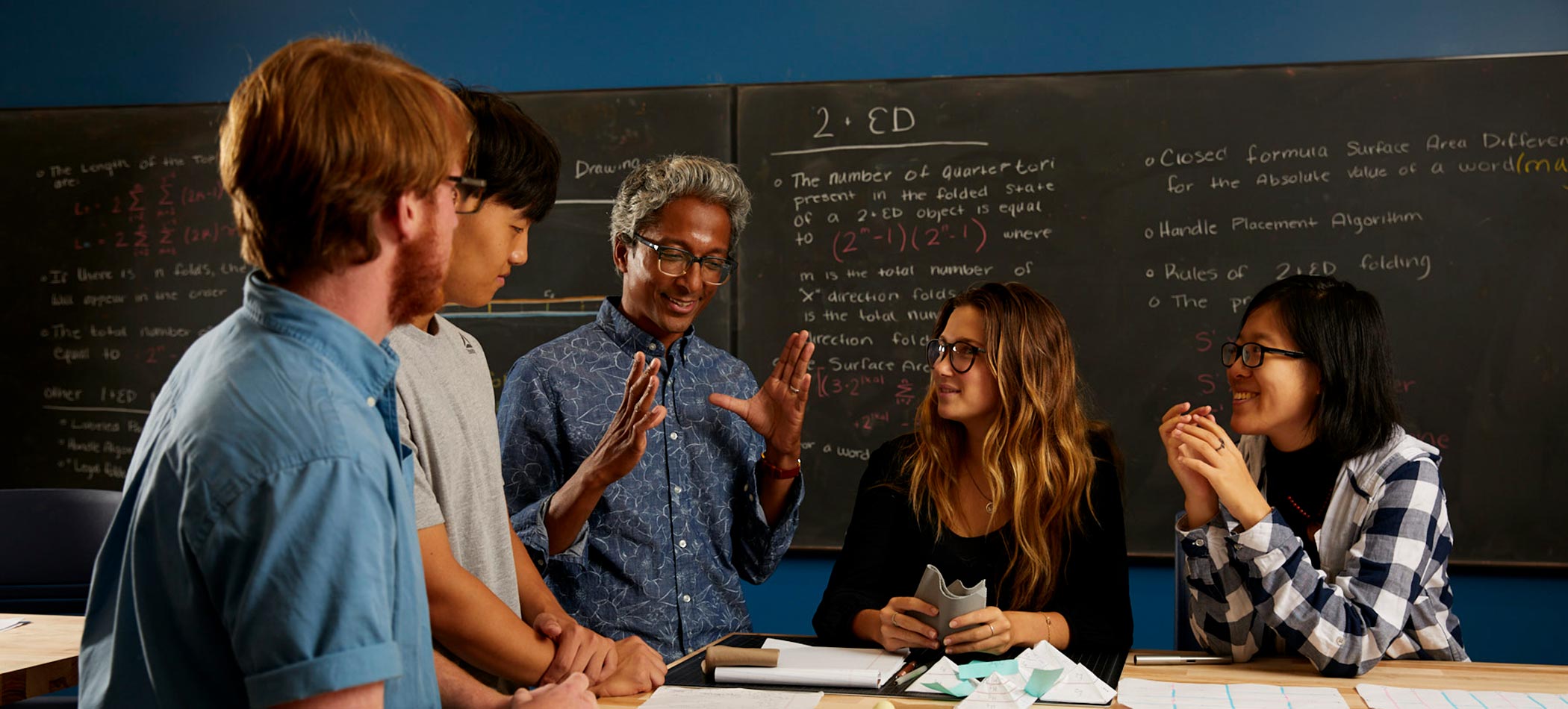 Students and professors doing research in a science lab