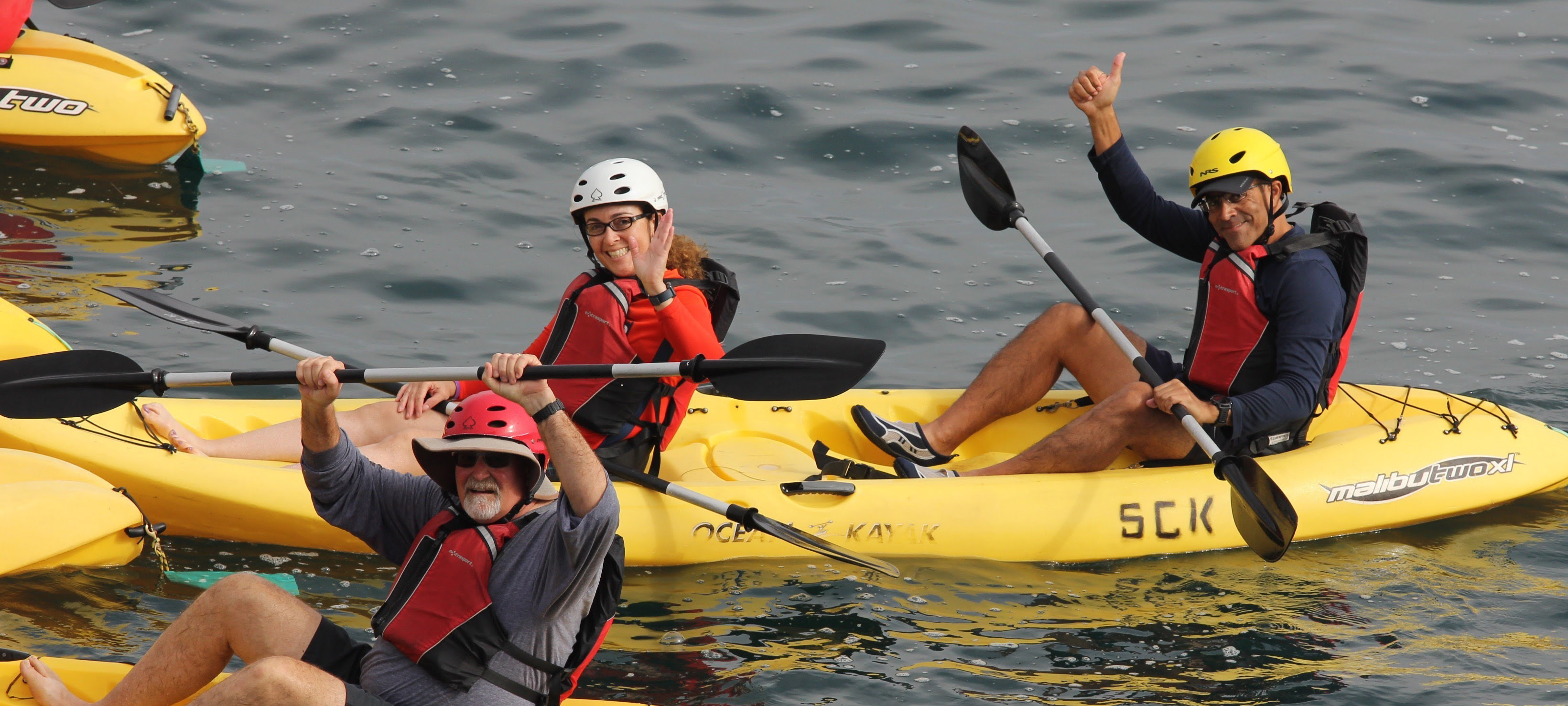 Three adults canoeing