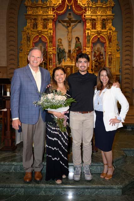 Parent and student inside the Immaculata with President Harris