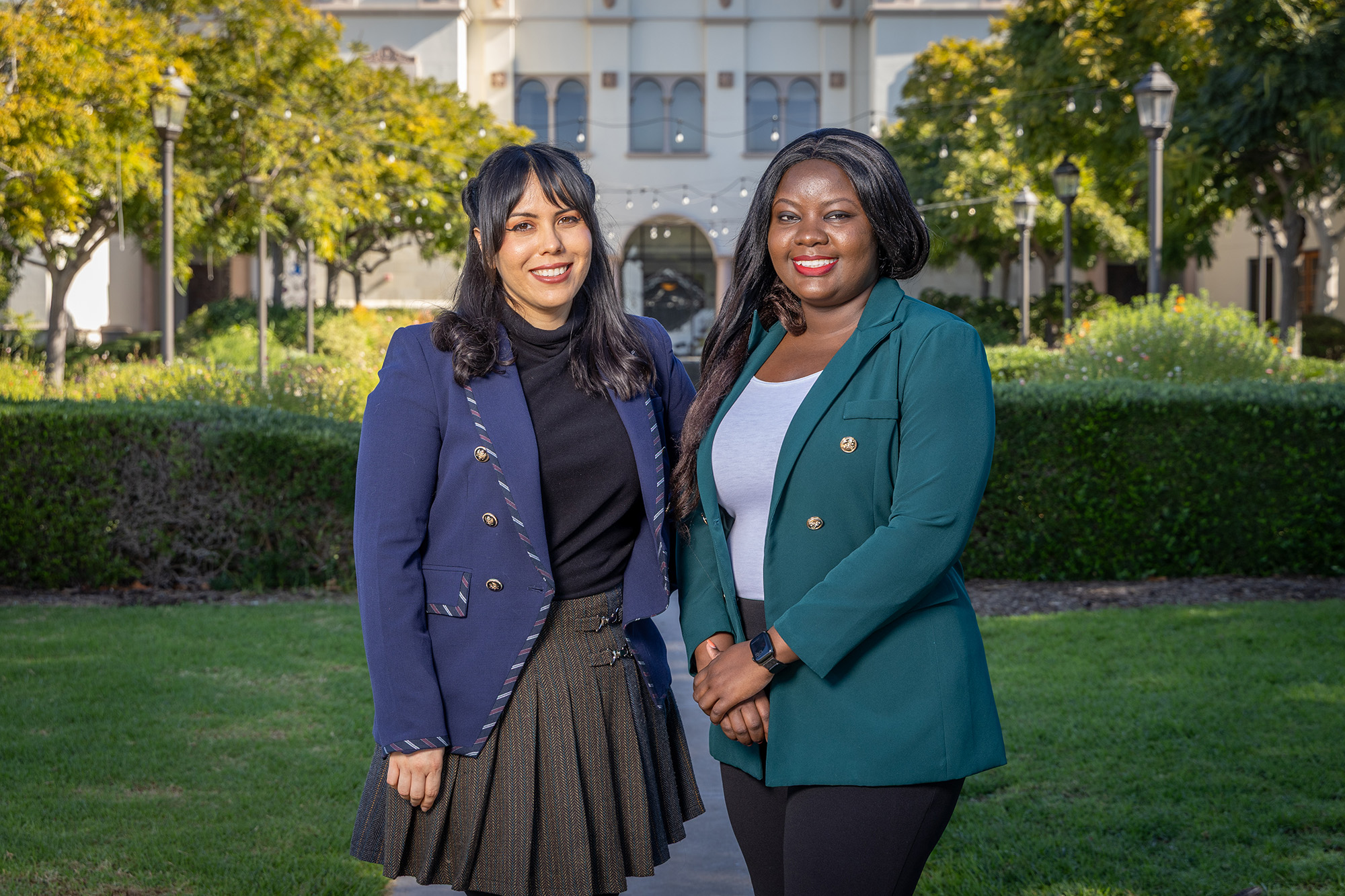 Two Women PeaceMakers smile in a garden