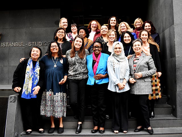 A group of women posing outside Istanbul Studios