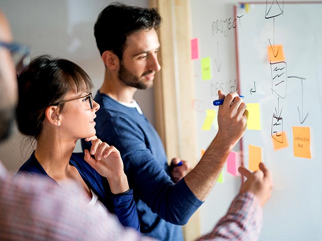 Students writing on a board