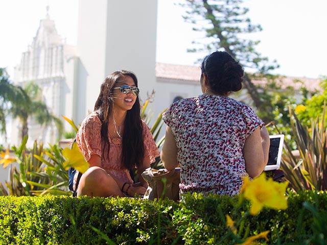 two people talking outside