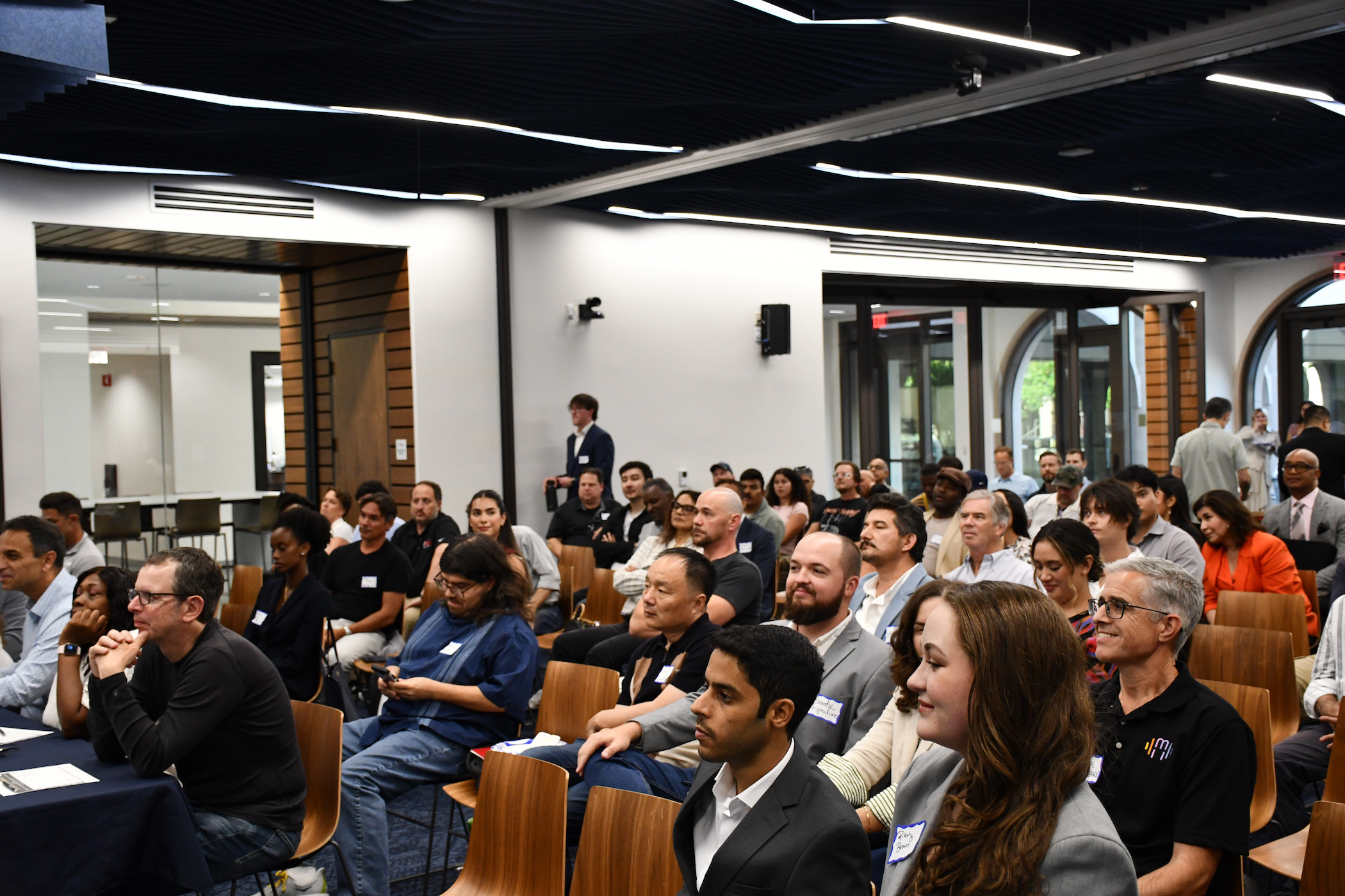 photo of a sitting audience in conference room