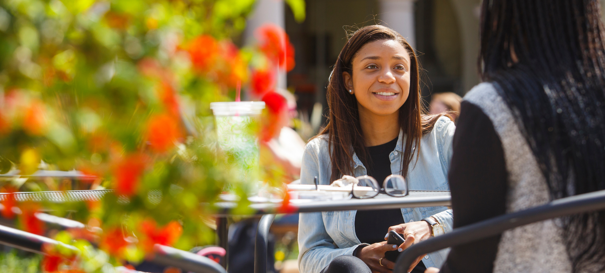 person sitting outside smiling