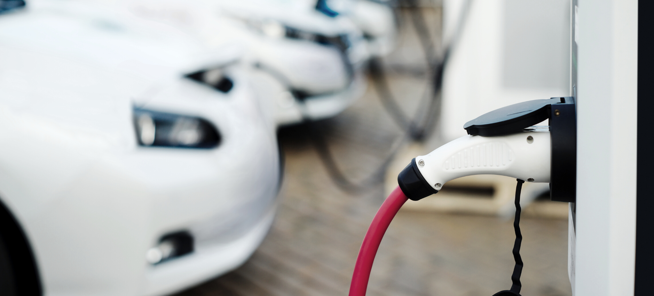 car at an electric charging station