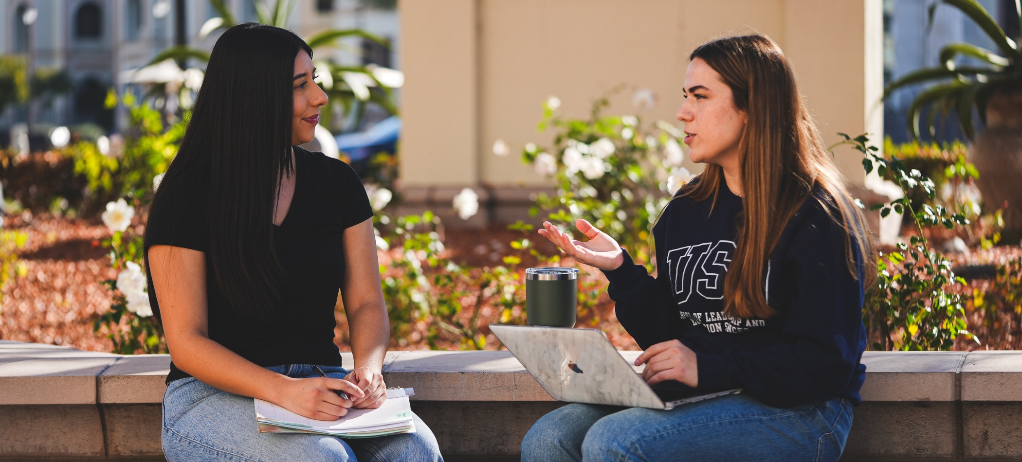 students talking on campus