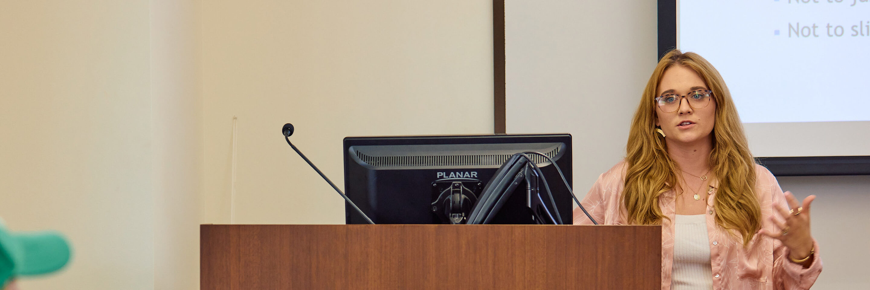 Young teacher speaking to classroom