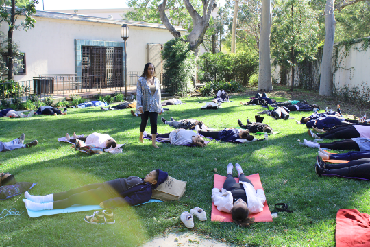 students practicing outdoor meditation