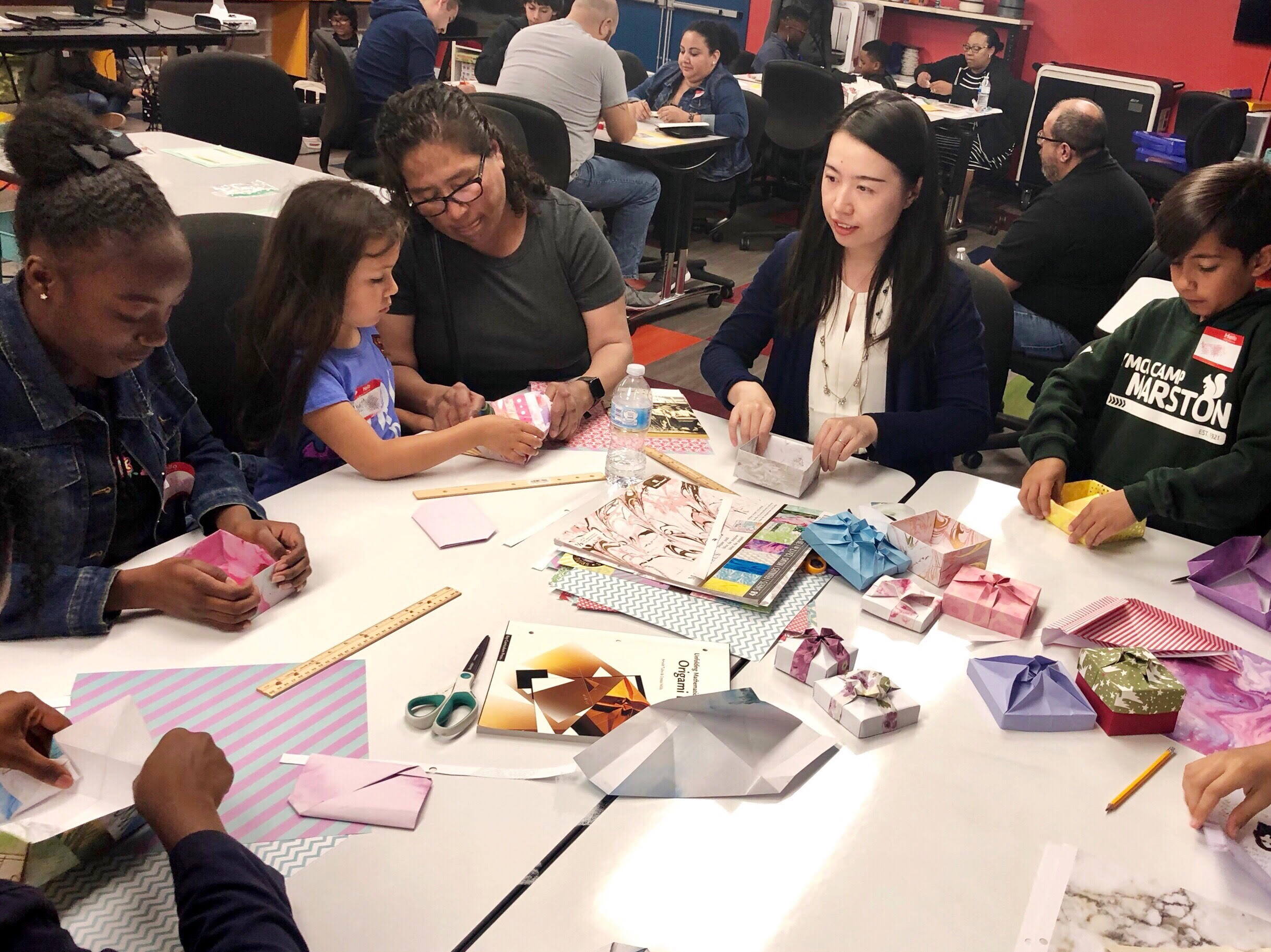 people making origami pinwheels