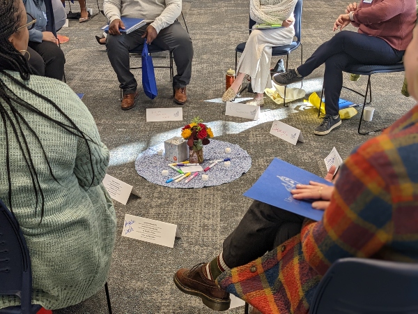 people sitting in a restorative justice circle