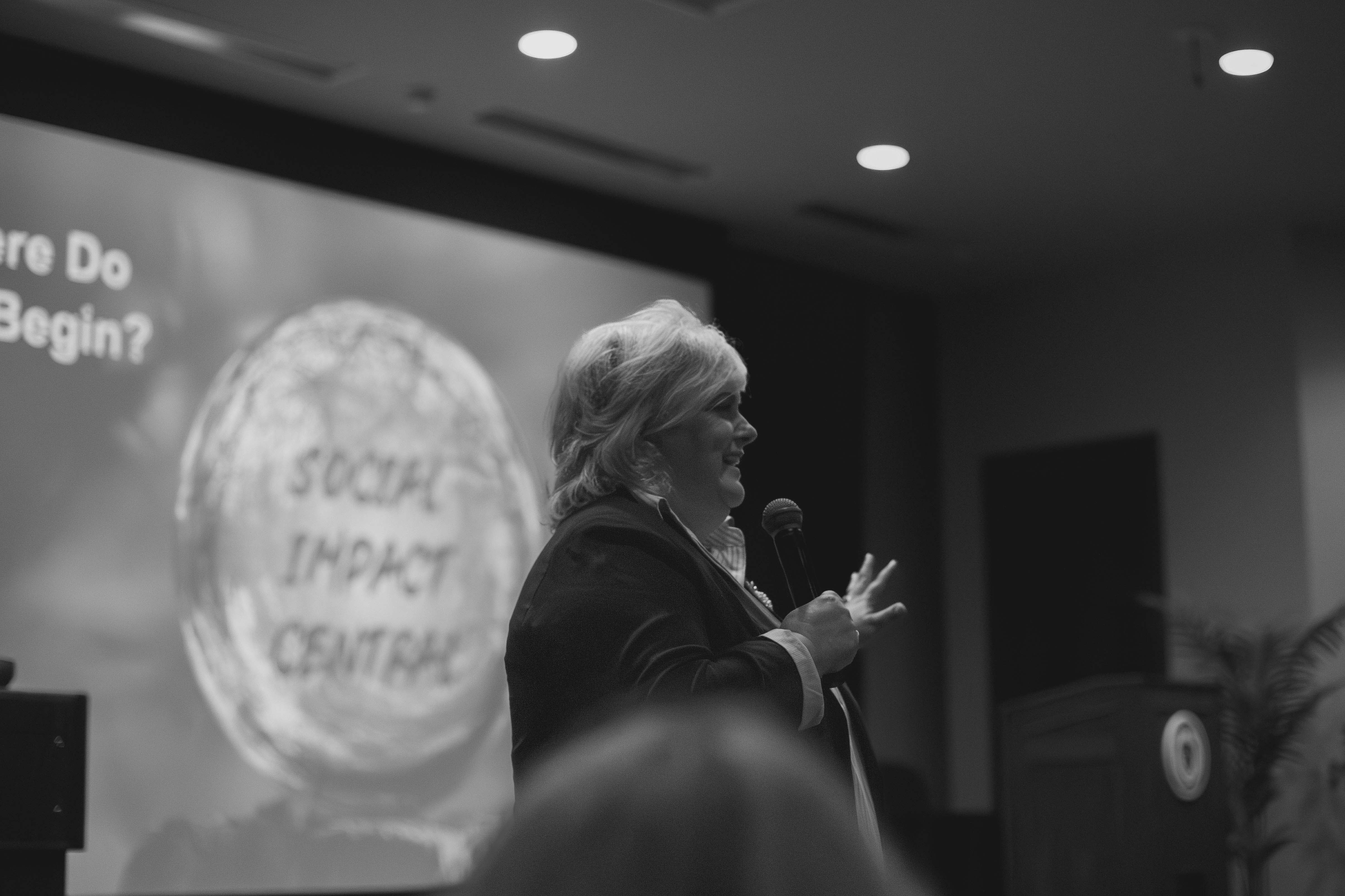 Laura Deitrick speaking at an event.